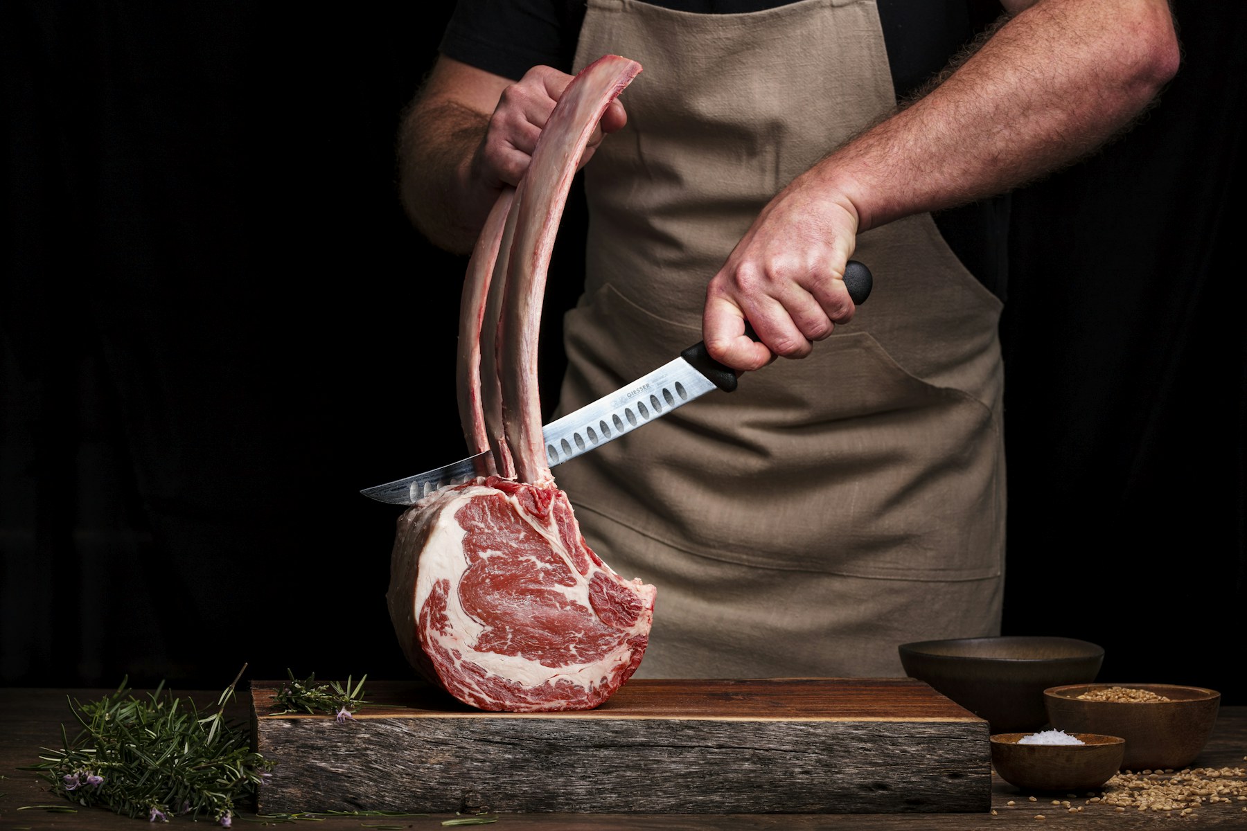 Raw marbled tomahawk steak with its long frenched rib bone